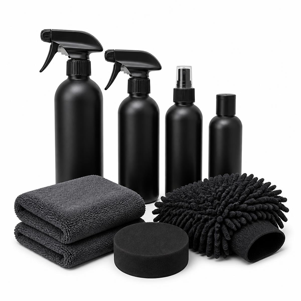 Car care kit with matte black spray bottles, microfibre cloths, applicator pad and wash mitt